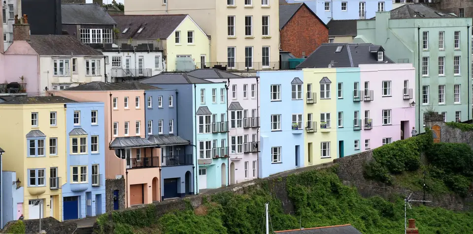 Pastel colour-washed terraced houses above the harbour in Tenby